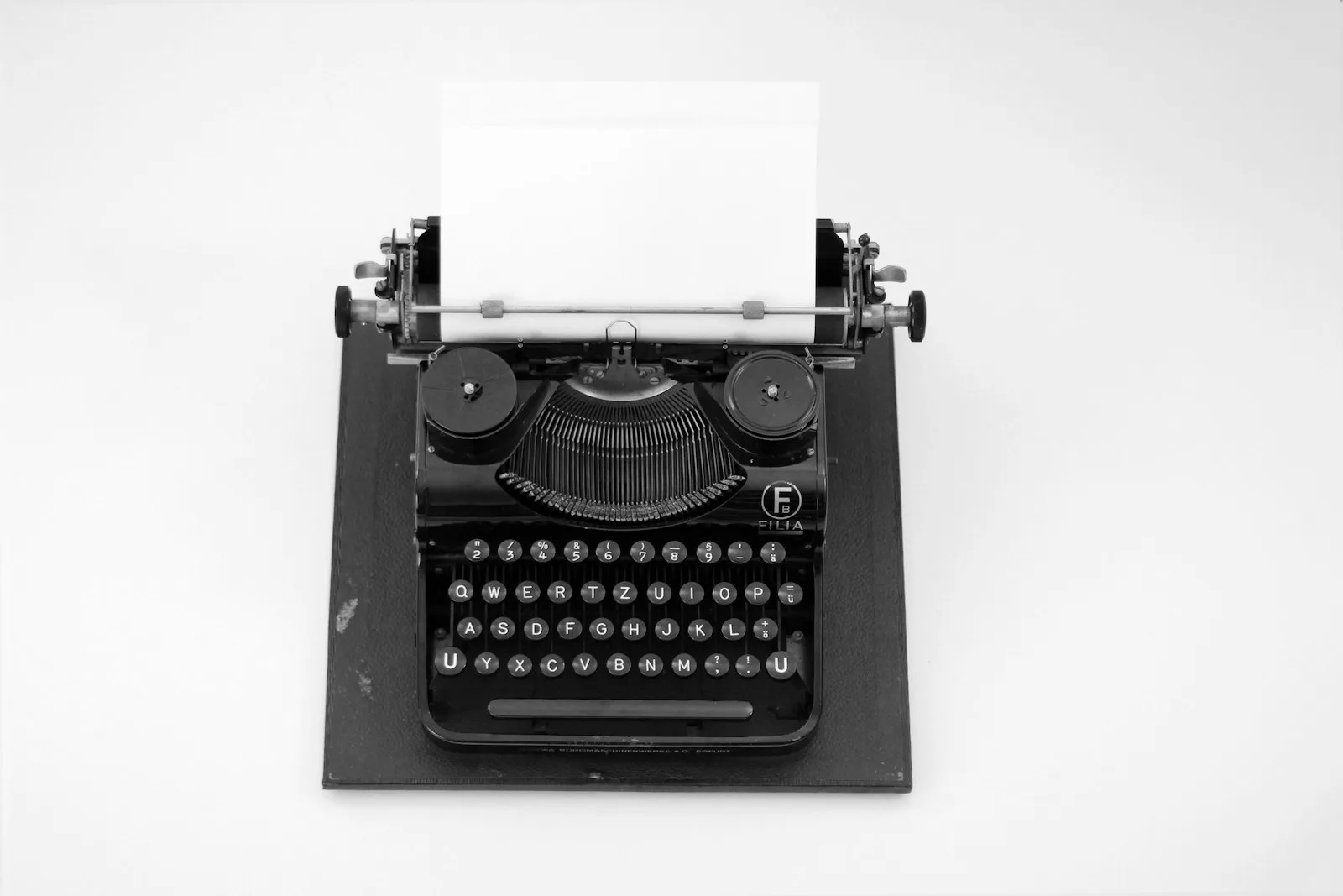 Black and white typewriter on a white table