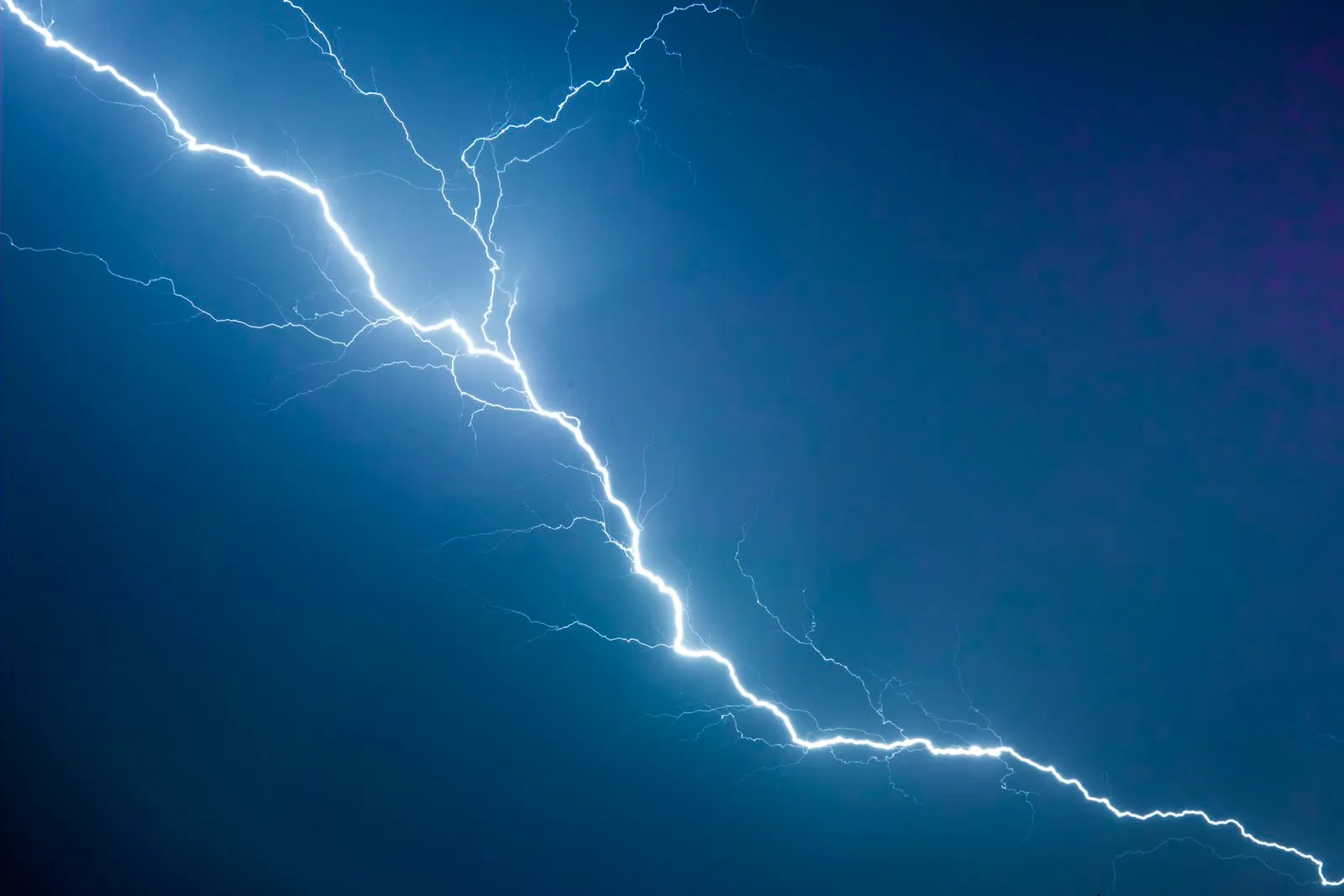A lightning bolt striking across a dark sky