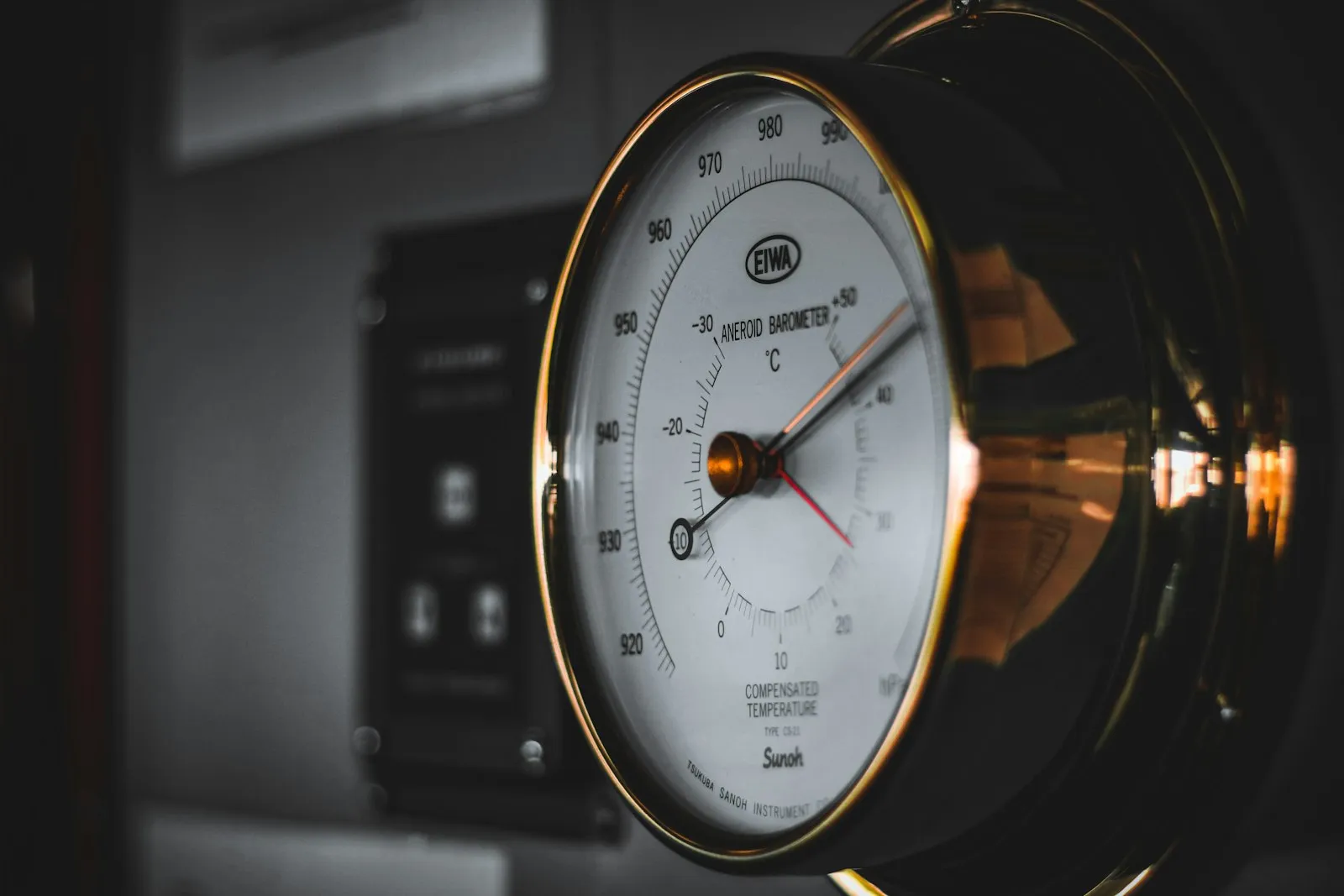 A plain clock hanging on a wall