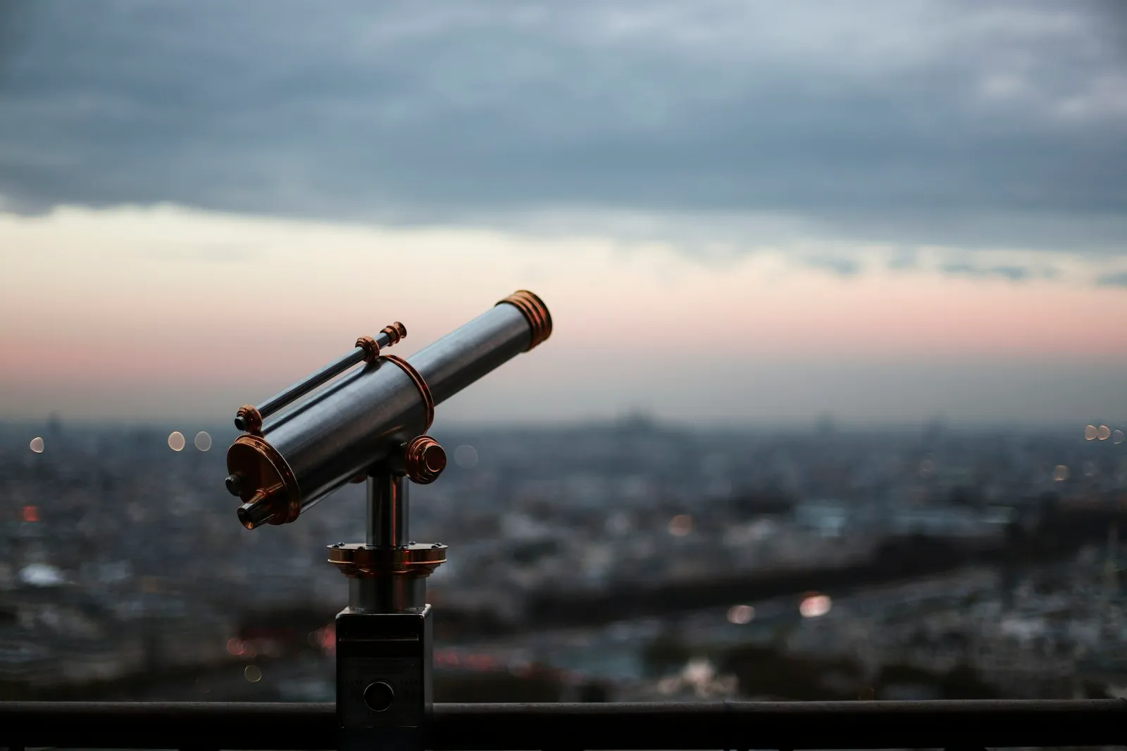 Black telescope standing outdoors in daylight
